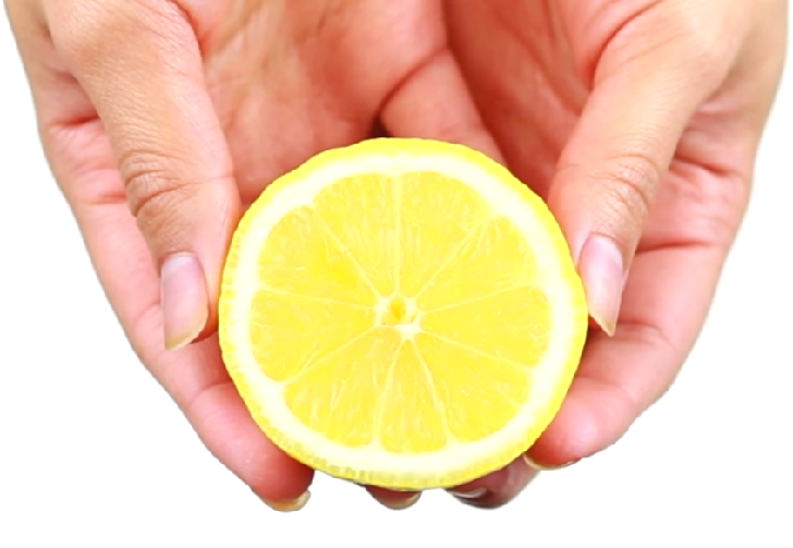 Woman with half cut lemon
