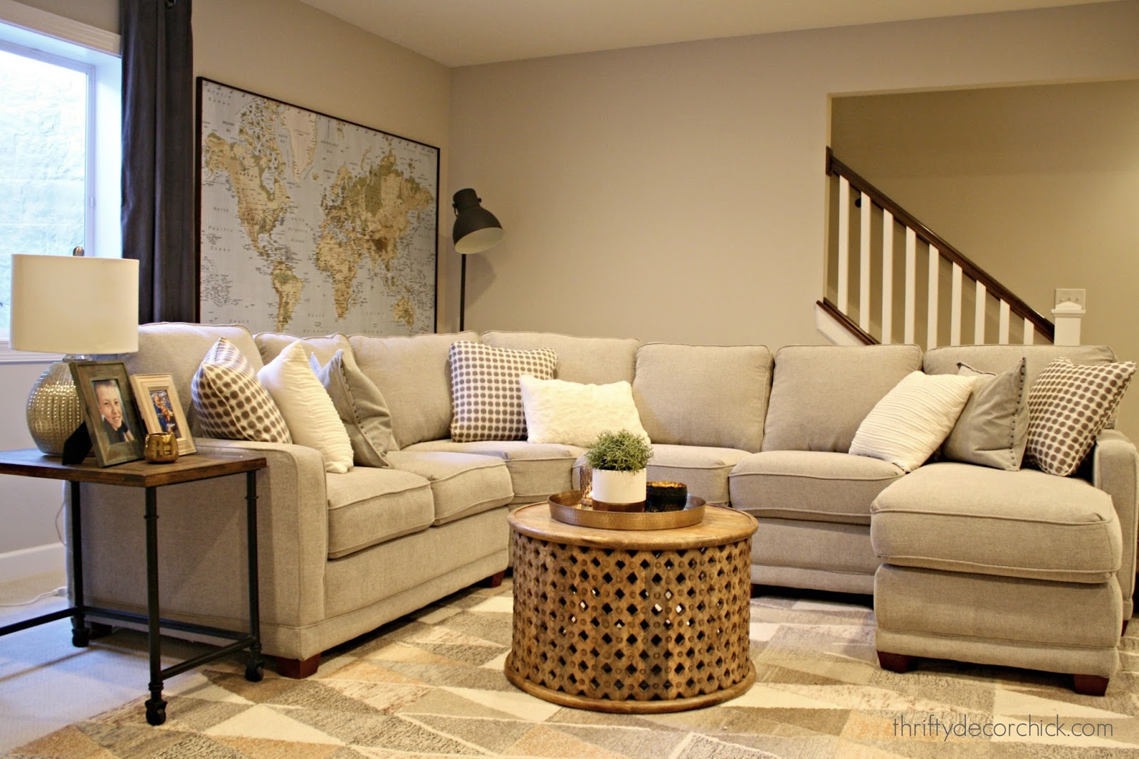 light gray sectional in basement