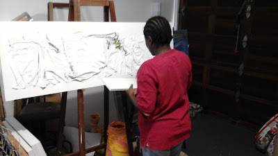 Miabo working on a Jeans project titled:  ' Life'   in her Art studio.