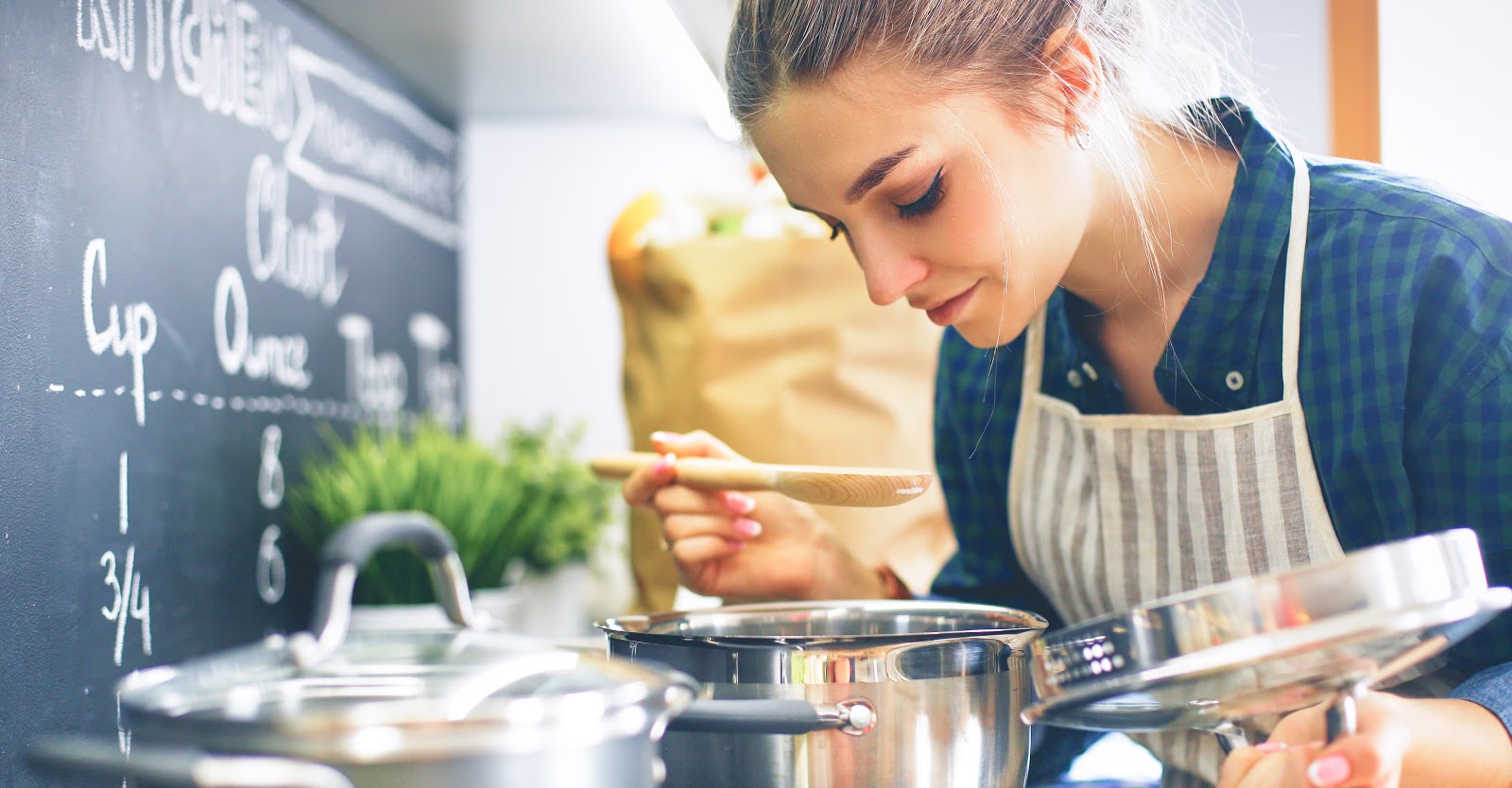 A young woman enjoys cooking a delicious recipe