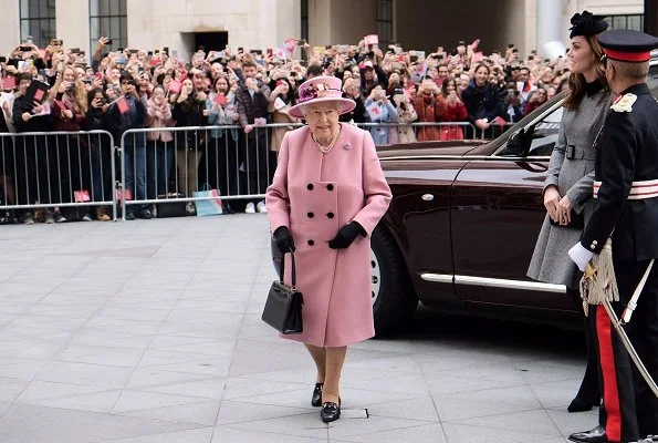 Kate Middleton is wearing a grey Catherine Walker dress and the Lock and Co hat