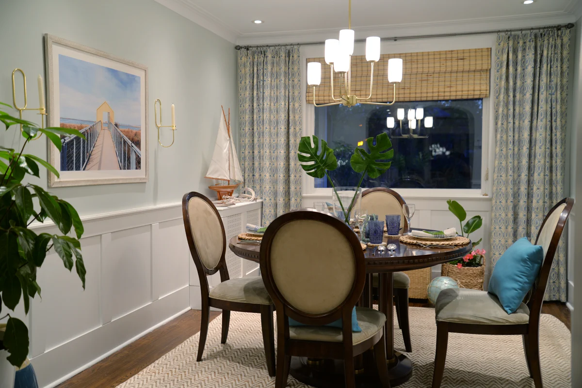 Rambling Renovators | tropical dining room, Hinkley Harlow chandelier, naga blue curtains