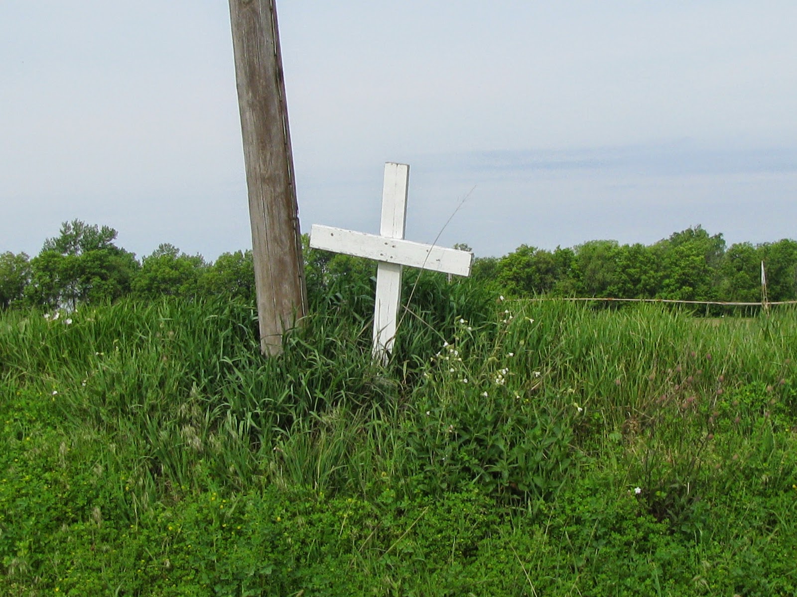 A Grave Interest Cross By the Side of the Road