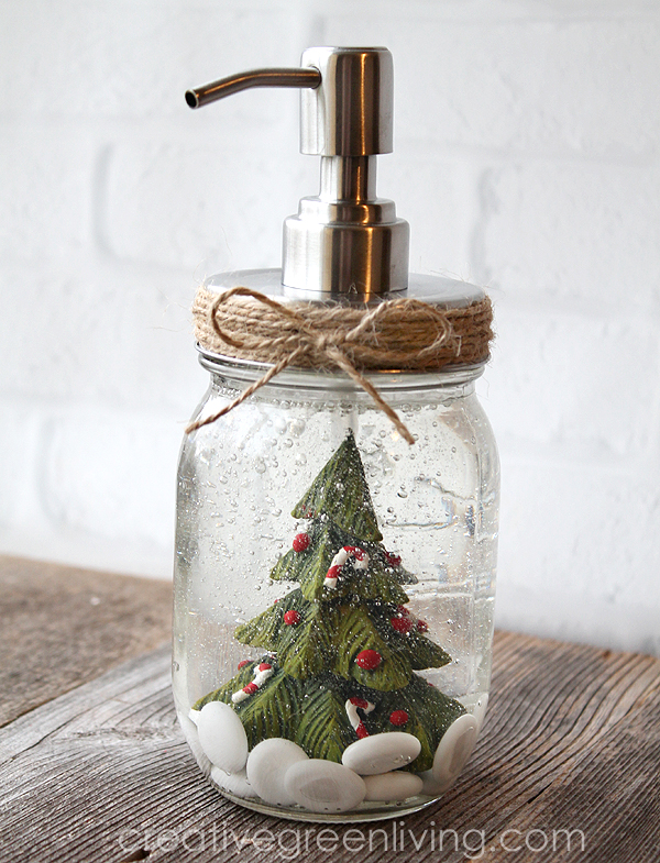 Homemade rustic mason jar soap dispenser with a Christmas tree inside