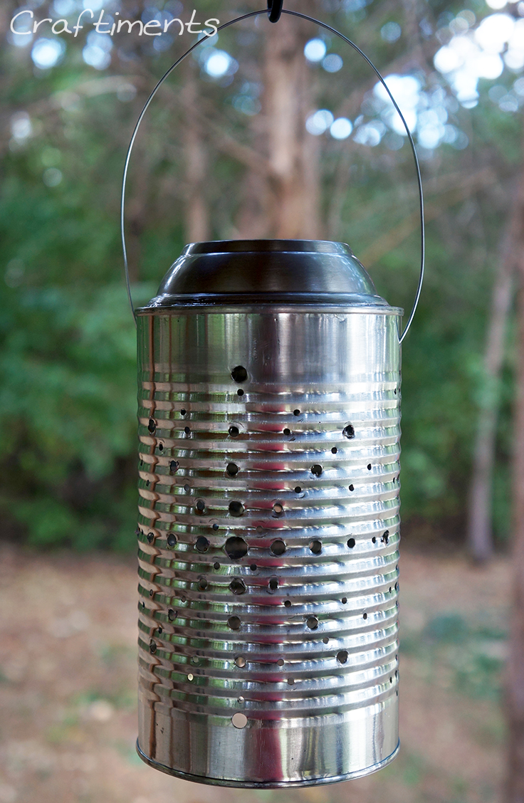 Tin can solar lantern charging in the sun.