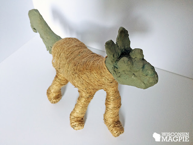 twine-wrapped dog covering a paper mache dog in jute twine