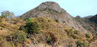 " A hill well known in Mount Abu .It now hosts a gmall temple"