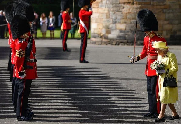 The traditional 'Ceremony of the Keys' took place tonight at Holyroodhouse in Edinburgh. yellow dress, jcoat and hat