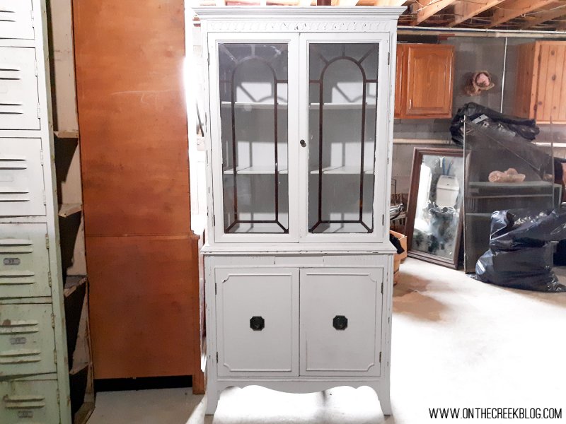 A makeover of a hutch from the Habitat For Humanity ReStore!  The hutch is painted in a chippy white with red accents!