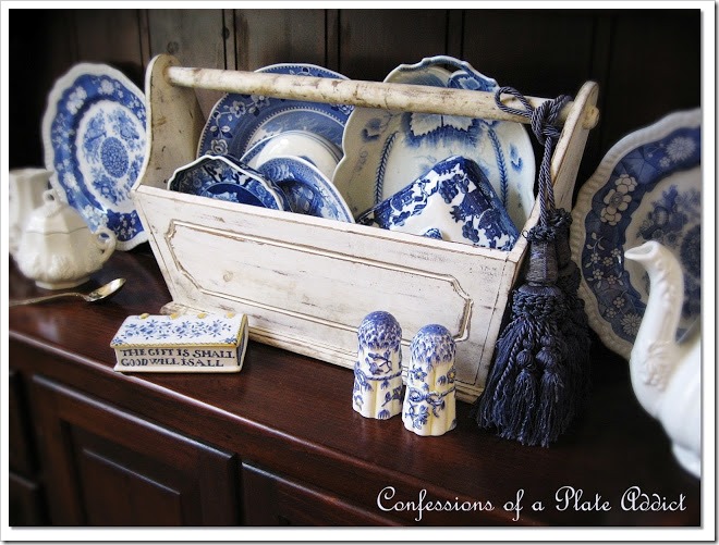 pretty blue and white dishes in a tool caddy