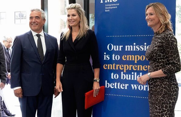 Queen Maxima wore Natan crepe jumpsuit. Queen Maxima's outfit is by Belgian fashion house Natan. red sandals and clutch