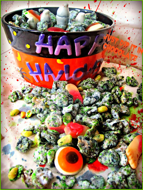 Zombie Skin Halloween Muddy Buddies Recipe Zombies are creeping in your kitchen and your party this season and you get to eat their flesh in this radioactive looking Muddy Buddy recipe. Who says you can't chase zombies and eat them too? #MuddyBuddiesRecipe #Zombies #HalloweenZombieFood #HalloweenRecipes
