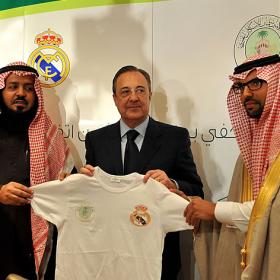 Perez holds a Real Madrid jersey during the presentation of the Riyadh academy