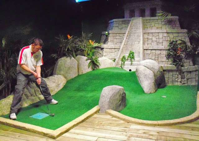Minigolfer Richard Gottfried playing the Jungle Rumble indoor adventure golf course at the Liverpool ONE shopping centre
