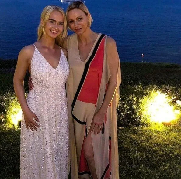 Princess Charlene wore a silk gown from Spring-Summer 2019 collection of Akris. Christos Fiotakis Elite fitness MC in Monaco