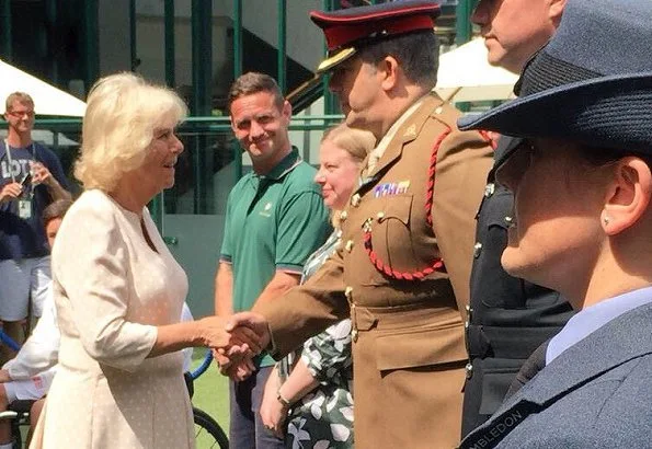 Countess Sophie wore Emilia Wickstead Vida Jumpsuit. Serbia's Novak Djokovic play Japan's Kei Nishikori during the men's singles quarter-finals match