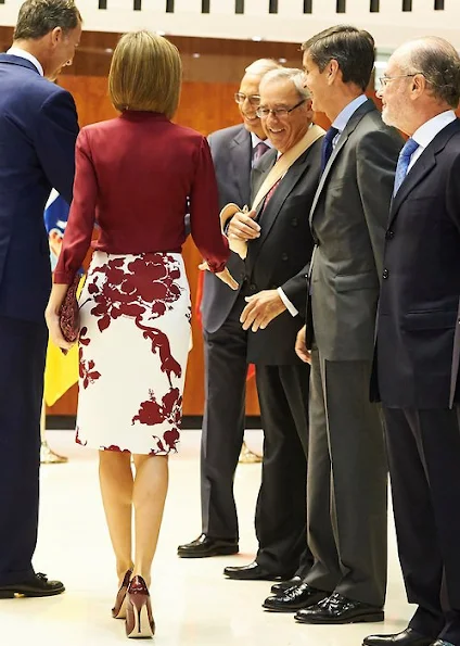 Queen Letizia attended an official lunch for Constitutional Tribunal. Felipe Varela satin blouse and floral skirt