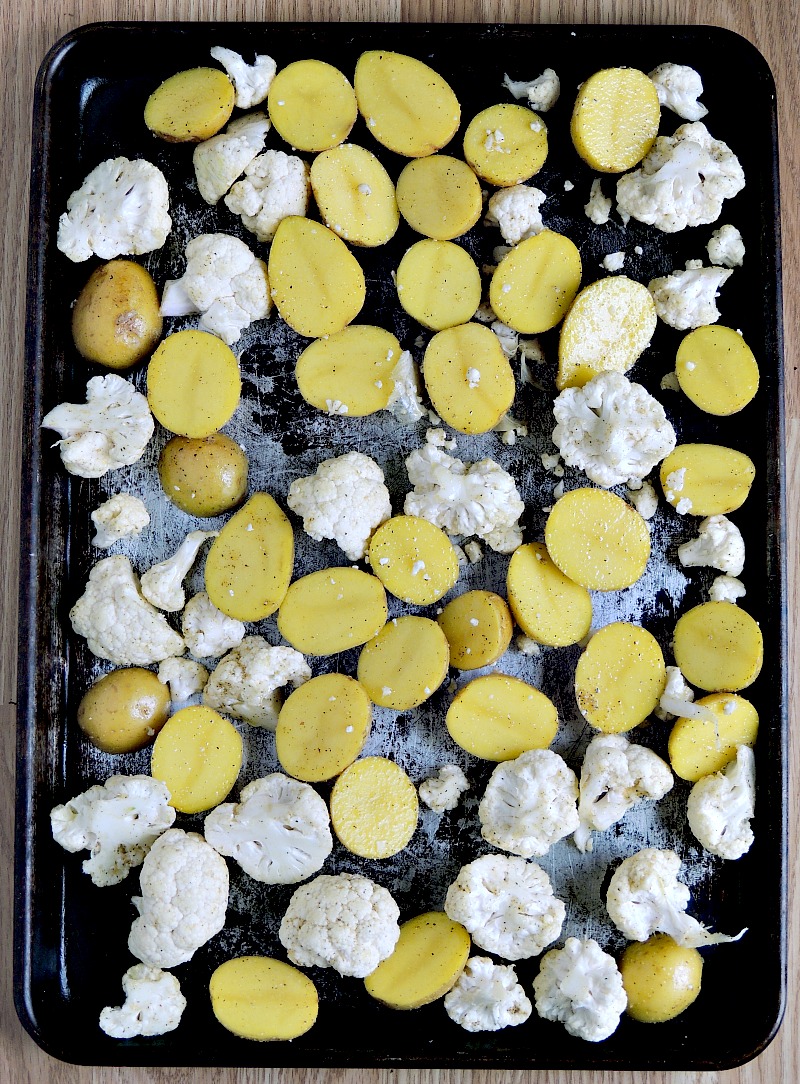 Potatoes and cauliflower on a metal sheet pan