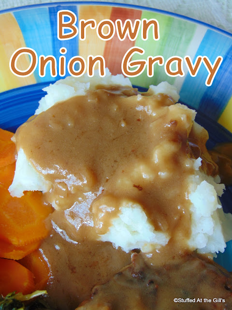 Brown Onion Gravy on a mound of mashed potatoes.