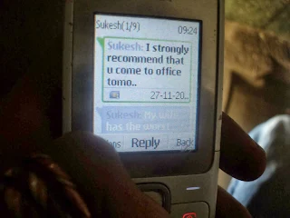 The hiker resting inside the cool, serene Nandi temple at the summit