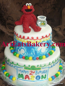 Two tier Elmo's World Seseame Street hand painted birthday cake with fondant Elmo and fish bowl top