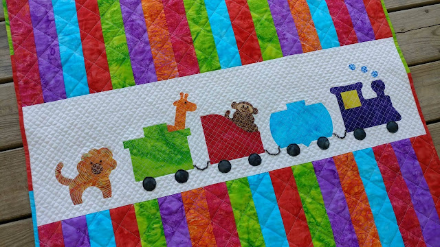 Row by Row On the Go zoo animals and train baby quilt