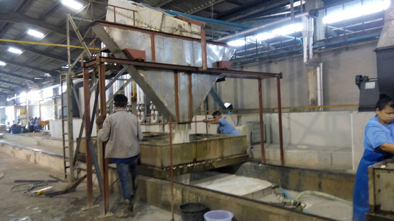 EMP GROUP OF COMPANIES LOADING OF WET RUBBER CRUMBS INTO DRYER TROLLEYS