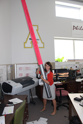 Jen holding a giant light saber like a true Star Wars fan!
