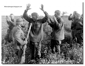 Searching captured Red Army soldiers for hidden weapons