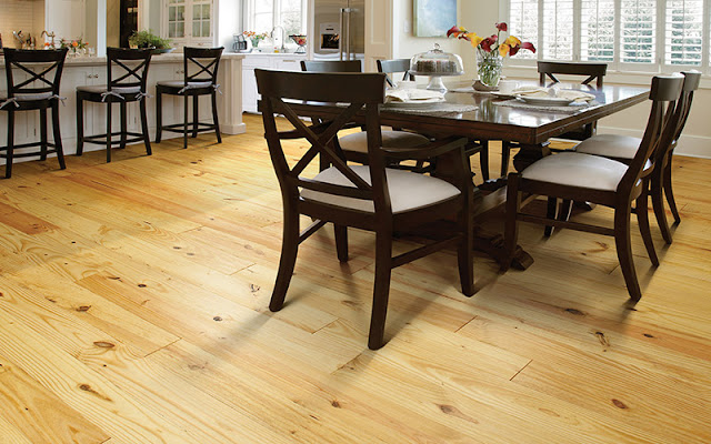 Beautiful natural hardwood floor stands up to the test in this kitchen/dining area.