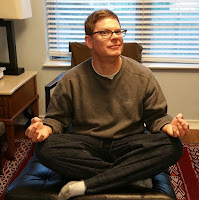 Weird man who seems to have broken into my house and started meditating on the ottoman