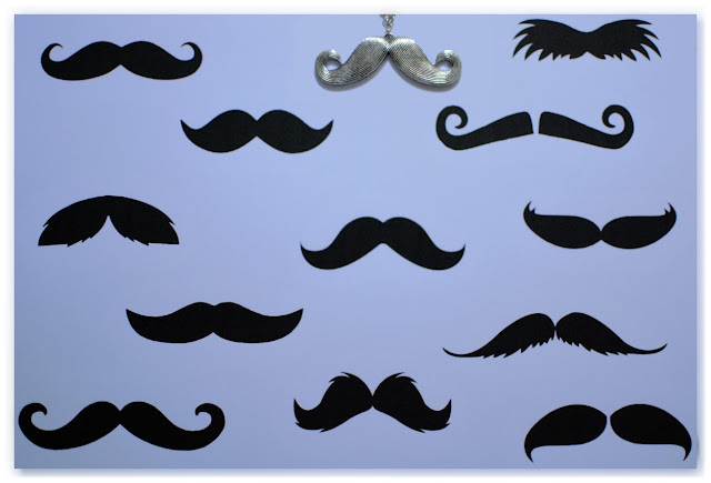 moustaches noires sur fond blanc et pendentif moustache