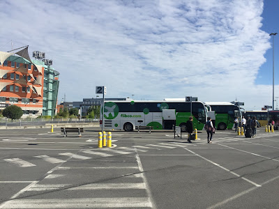 flibco bus at brussels airport under a blue sky
