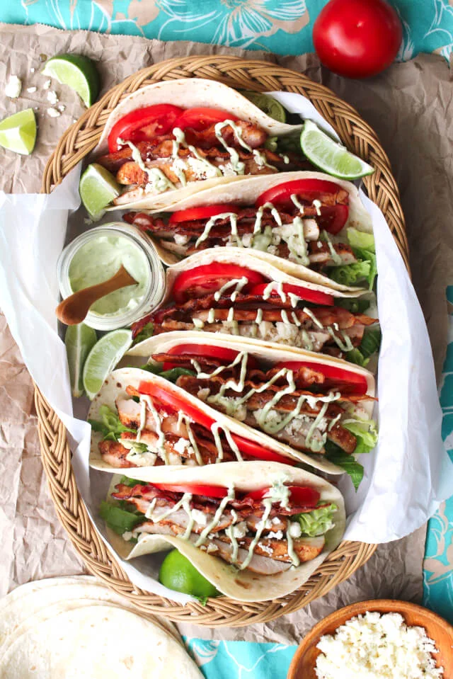 BLT Grilled Chicken Tacos are a fresh and summery twist on tacos made with classic BLT ingredients, dry-rubbed grilled chicken, and a cool avocado ranch drizzle. #MissionOrganics #ad @missionfoods