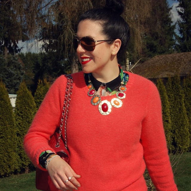 Floral blouse, coral sweater, red J brand jeans, Chanel flap handbag, statement necklace, Zara suede boots.