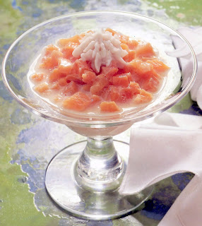 Banana-flavoured Apricots with Coconut Cream: Dessert of apricots soaked in banana-flavoured soya milk served with coconut cream in a dessert glass