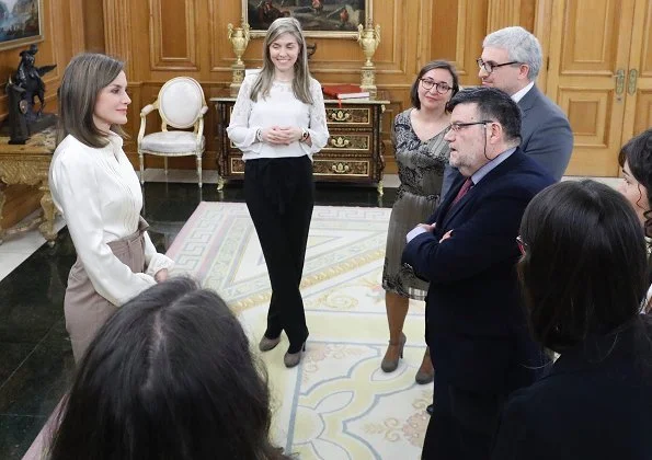 Queen Letizia wore camel Hugo Boss block-heel pumps, silky billow sleeve blouse and Atelier Swarovski Kalix Double Stud Pierced Earrings