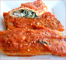 Meatless Manicotti: A hot bubbling dish for a cold fall or winter night. This meal is so hearty and filling you won't even miss the meat. Serve with Garlic Bread and a salad and dinner is complete. | Recipe developed by www.BakingInATornado.com | #recipe #dinner