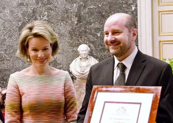 Queen Mathilde was glowing in a bold, form-fitting pastel-hued dress, she wore with a pair of classic nude heels, as she arrived at the Baillet Latour Health Prize ceremony