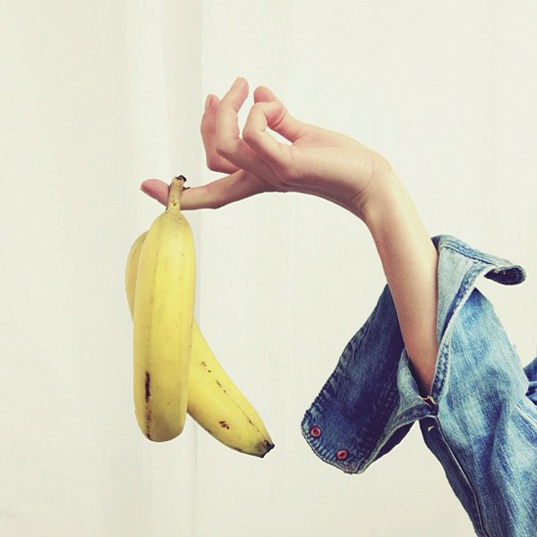 holding a banana, denim shirt