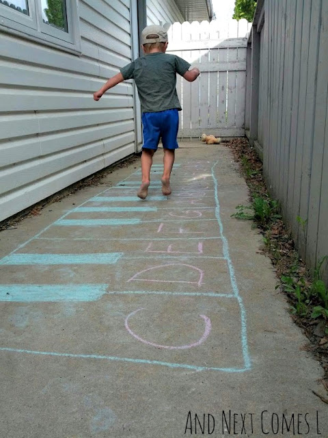 Child jumping on a chalk keyboard