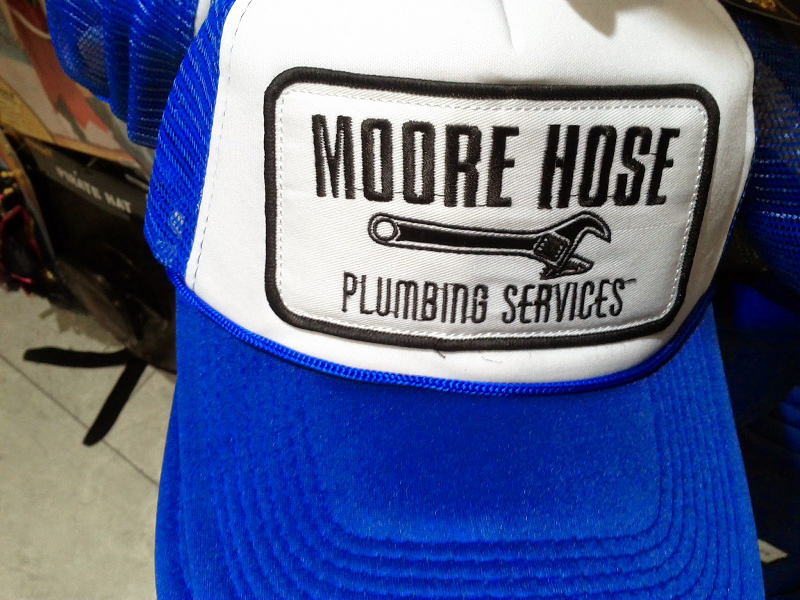 Toronto things: Moore Hose Plumbing Services cap and Drunken Clam hat