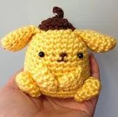 http://www.ravelry.com/patterns/library/crochet-purin-purin-artist-dog-doll-toy