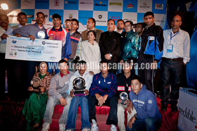 With fun filled 8 days journey of MTB Himachal ended at Shimla Ridge on 8th October, 2011 !! There was prize distribution function on Ridge ground during evening and a grand party in Ritz after that. Let's have a quick PHOTO JOURNEY of the last evening on MTB  Himachal 2011 !!!Here comes the very first photograph of all the Marshals and Volunteers, who are real executors of MTB Himachal 2011. Although this photograph was clicked during the end of prize distribution ceremony, but it's one of the important one and fits well for top photograph of this Photo Journey.Here we have all the winners in various categories. Mohit Sood on mic and Dhananjay on other end. State Minister Narender Baragata was Chief Guest in this ceremony and he handed over few of the main prizes of MTB Himachal 2011 !!Boon and M. Atri also joined in from right side... There were different categories in MTB Himachal 2011 - Master's Category, Team Competition and Champion trophy etc.Various delegates from T1 cycles, Himachal Tourism and other sponsorship companies were present during this final ceremony of MTB Himachal 2011. This ceremony takes place on top of Indira market near Ridge Ground of Shimla, Himachal Pradesh.After Prize distribution ceremony, Mr. Narender Baragata talking to media folks on Ridge ground, Shimla. Mr. Rohit Sharma with Camera on right side. He has been with MTB Himachal rally for 8 days and relayed three full episodes in Shimla Doordarshan & Sports channel.Mr. Narender Baragata expressed his views about cycling and importance of such event in Himachal Pradesh. At the same time he assured that Himachal Pradesh Government will ensure safe and successful events in future. Although most of these events are run by private organization, but Himachali politicians are very well involved in most of them...It was a long press conference on Ridge Ground of Shimla. All press folks as well as Himachal Pradesh ministers were seemed interesting in conversation about MTB Himachal 2011 !!!Here is Mr. Dutta Patil, who was runner in masters category. He belongs to Maharashtra and he has been riding bare feet for last 16 years. In fact he has not used footwear for last 16 years or so. If someone ask him why, his reply is like - I never a need... Can you imagine?Two girl winners of MTB Himachal 2011, having a photograph with VIP guests of final ceremony on Ridge ground of Shimla, Capital city of Himachal Pradesh.Here comes another set of energetic people, who are called as Marshals and Volunteers of MTB Himachal 2011. The real executor of this event. People who have worked hard after compromising many things during 8 days of MTB Himachal 2011.Their enthusiasm and passion was commendable. Hope HASTPA would have appreciated their efforts with some tokens on same day. Alas it didn't happen this year. In 2010, they were very well appreciated with appropriate tokens and certificates. Hope they will got some tokens after completion of this event...VIP Guests sitting on front row on Ridge Ground, where MTB Final ceremony took place...Political talks with nice laughter :) ... Mr. Suresh Bhardwaj and Mr. Narender Baragata !!With this MTB Himachal Pradesh 2011 completed and now it was time for Party. I preferred not to click any photographs in Party as event was over and it was time to enjoy :) ... Now on to MTB Himachal Pradesh 2012 !!! Let's see how things work out... 
