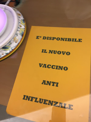 Sign indicating that the flu vaccinations are available.