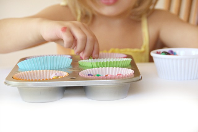 Scooping, pouring, transferring beads and developing fine motor skills and hand dominance in Toddlers, Preschoolers, and school-aged kids. Plus learning ideas to use in scooping activities. From an Occupational Therapist.