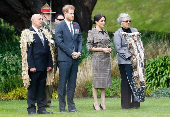 Meghan Markle wore Karen Walker Banks coat, Asos Design Maternity dress, Sarah Flint pumps and Birks Musecitrine and diamond drop earrings