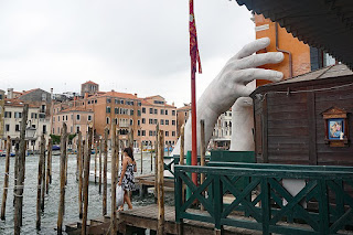 A pair of giant hands reaching from the water to prop up the Ca' Sagredo Hotel was an exhibit at the 2017 Venice Biennale