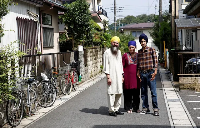  Image Attribute: Gursewak Singh (R) and his parents pose for a photographer next to their house (L) during an interview with Reuters, in Matsudo, Japan, September 25, 2016.    REUTERS/Kim Kyung-Hoon
