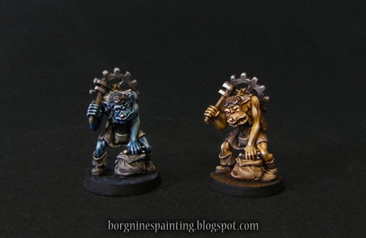 Two Mekanorcs painted for use in Dungeon Twister game, one yellow, one blue